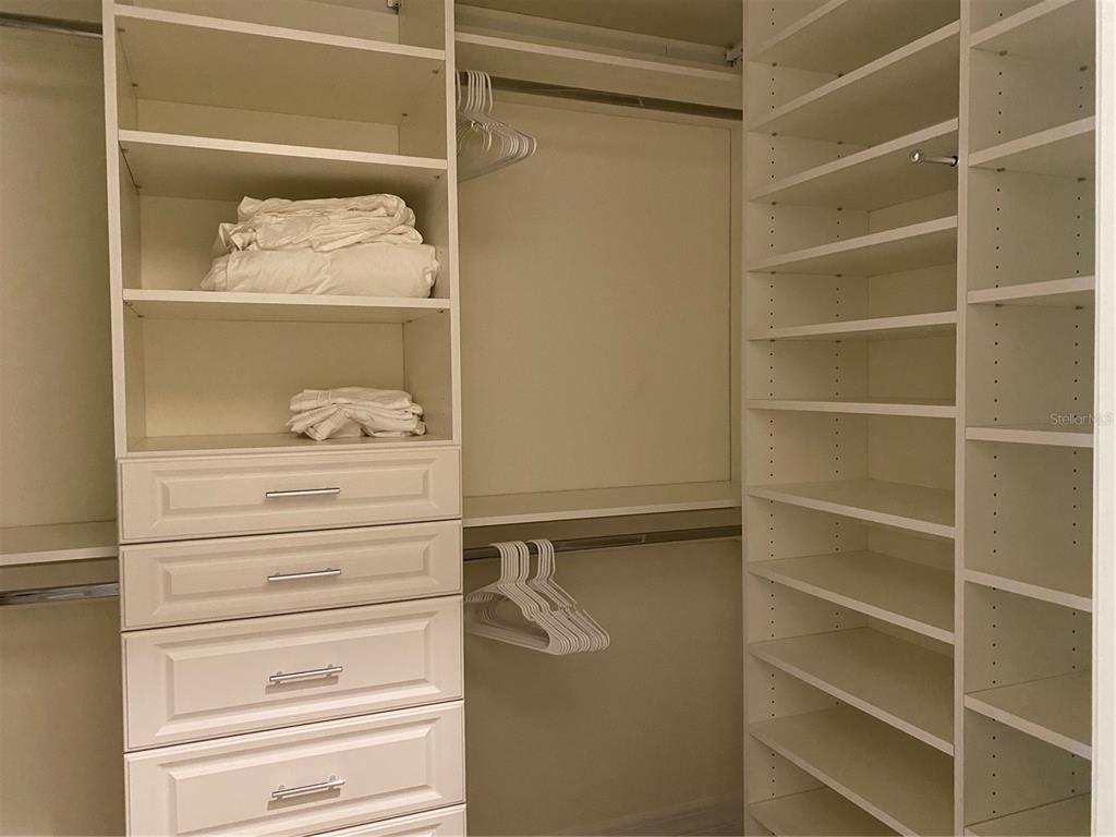 17525 Hickok Belt Loop Bradenton, FL 34211 - Photo 17 of 31 a view of walk in closet with clothes and shoes
