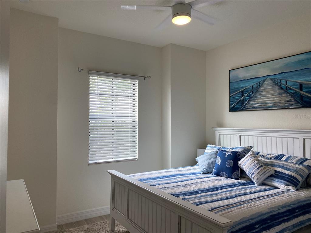 17525 Hickok Belt Loop Bradenton, FL 34211 - Photo 18 of 31 a bedroom with a bed and a window