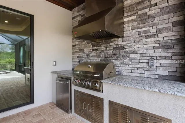 a kitchen with a stove and a shower