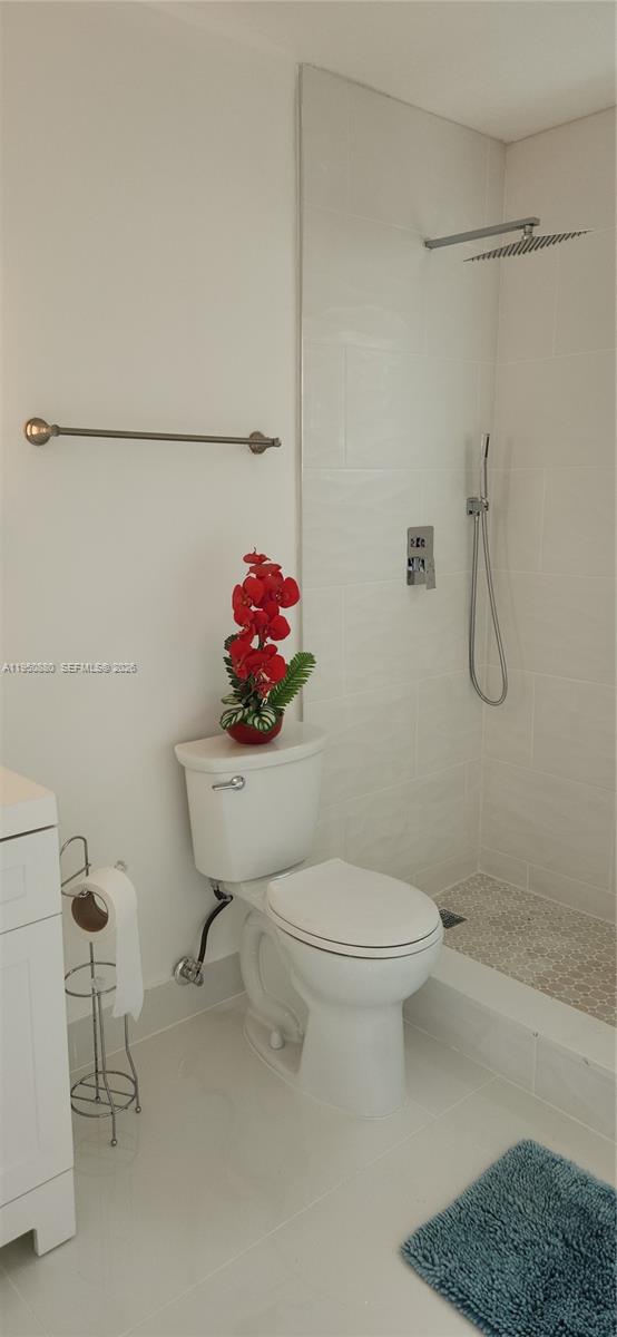 17930 Southwest 136th Avenue, Unit B Miami, FL 33177 - Photo 2 of 4 a bathroom with a toilet and a shower