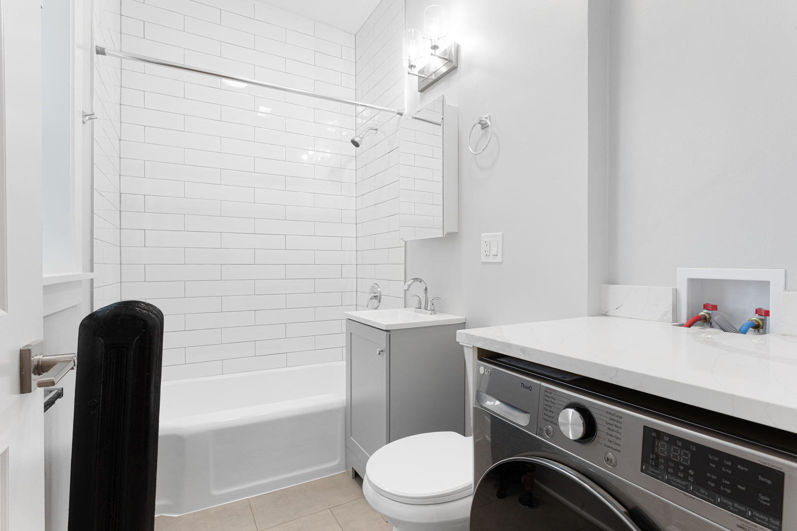 7600 North Sheridan Road, Unit 203 Chicago, IL 60626 - Photo 10 of 10 a bathroom with a sink a toilet and shower