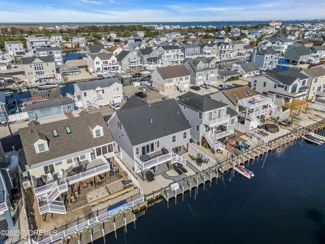 an aerial view of a city with ocean view