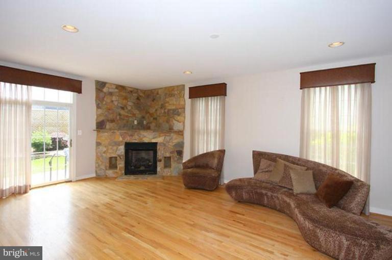 5200 Ridgefield Road Bethesda, MD 20816 - Photo 3 of 15 a living room with furniture and a fireplace