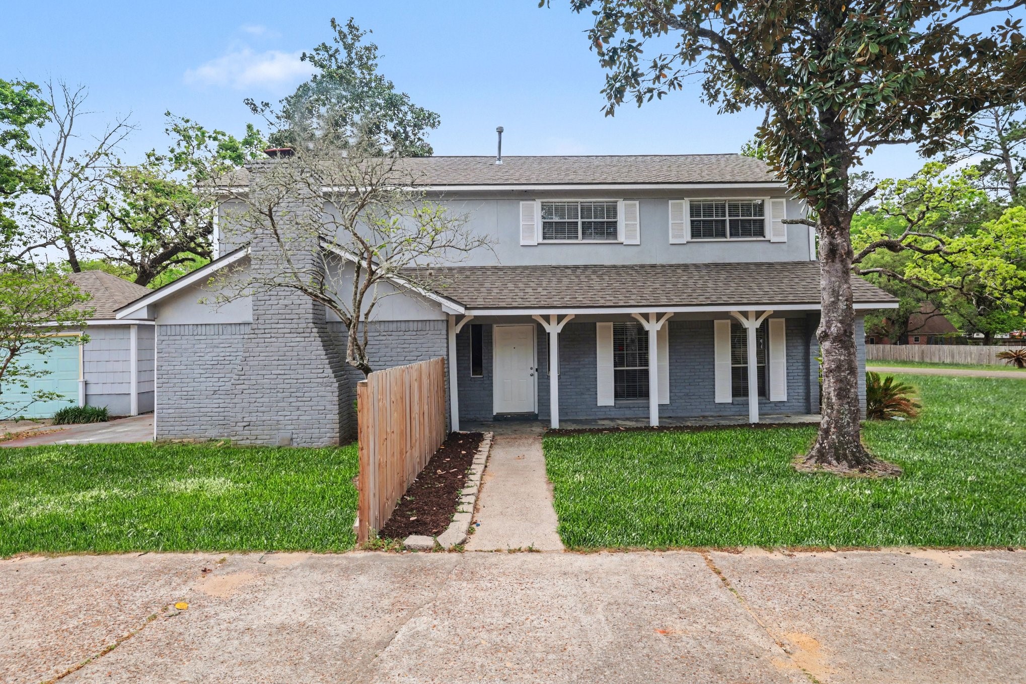 front view of a house with a yard