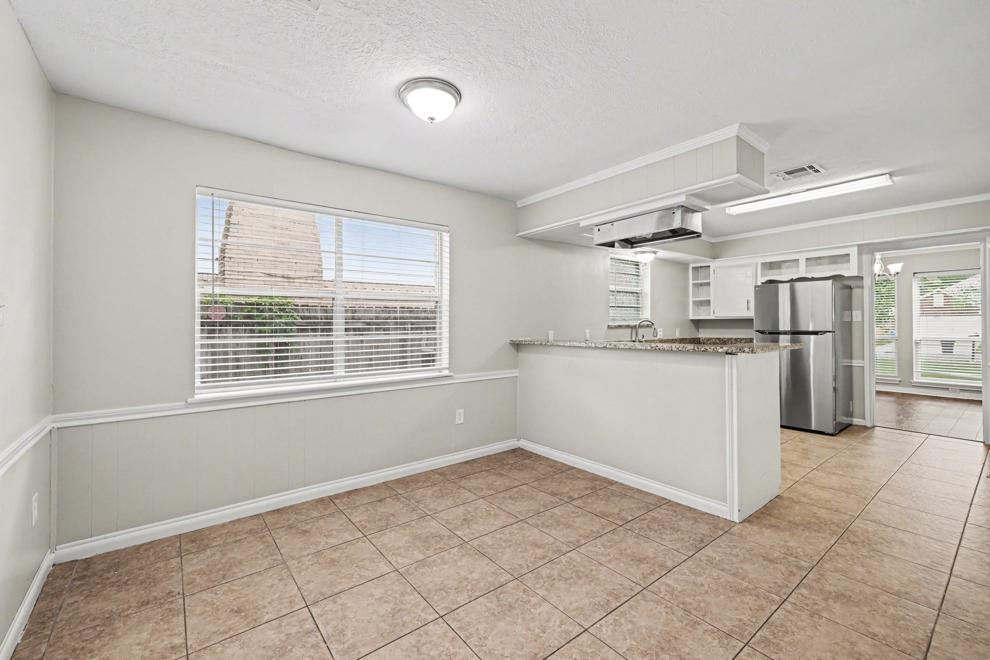 107 Carriage Lane Conroe, TX 77385 - Photo 12 of 26 a big room with windows