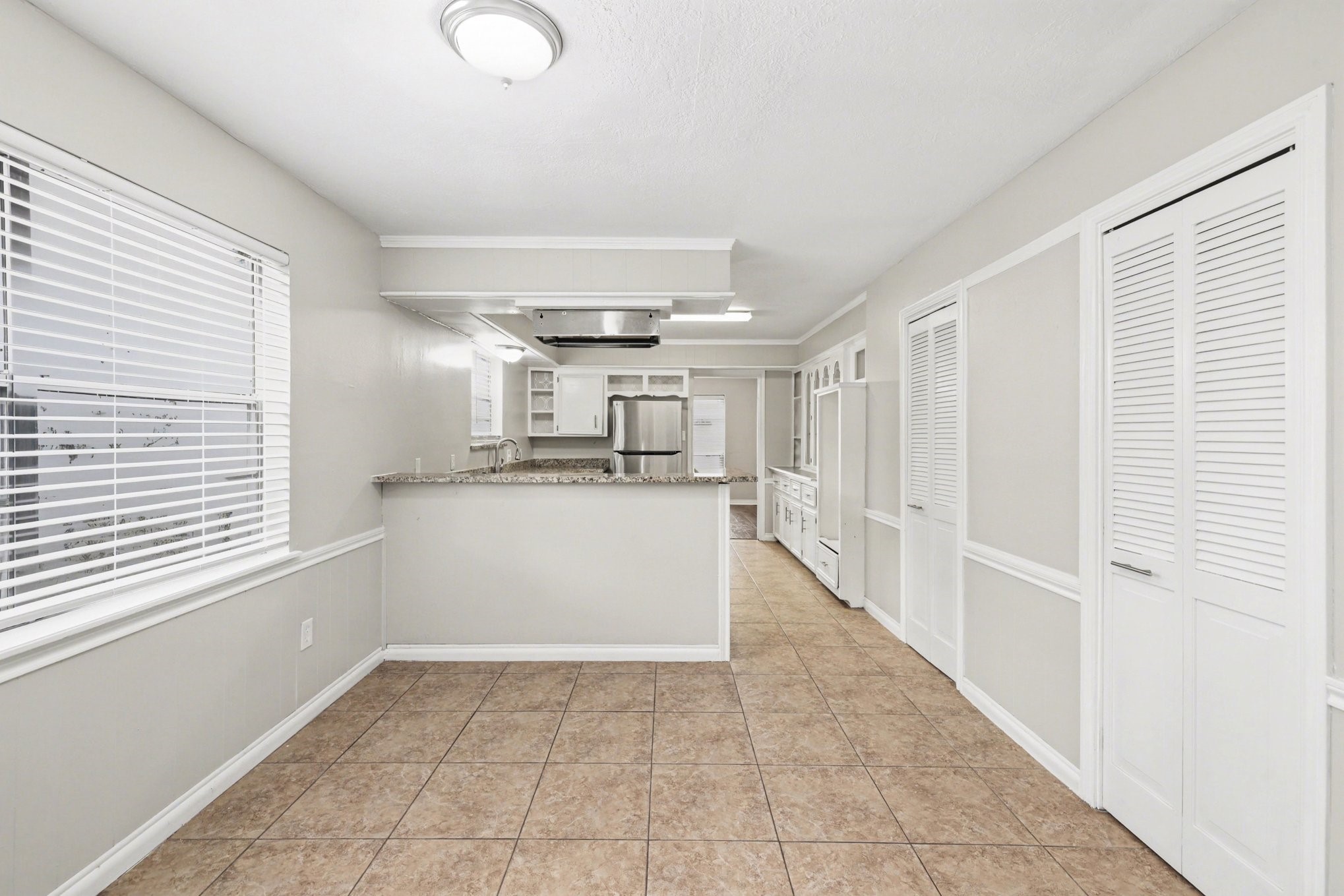 107 Carriage Lane Conroe, TX 77385 - Photo 13 of 26 a view of a kitchen with a sink
