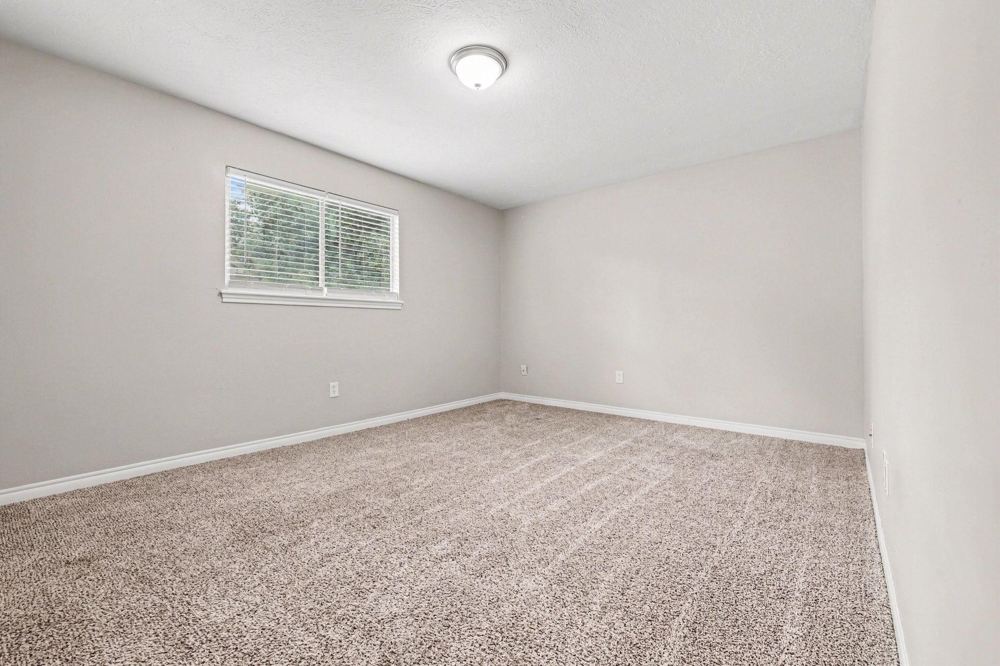 107 Carriage Lane Conroe, TX 77385 - Photo 20 of 26 an empty room with a workbench