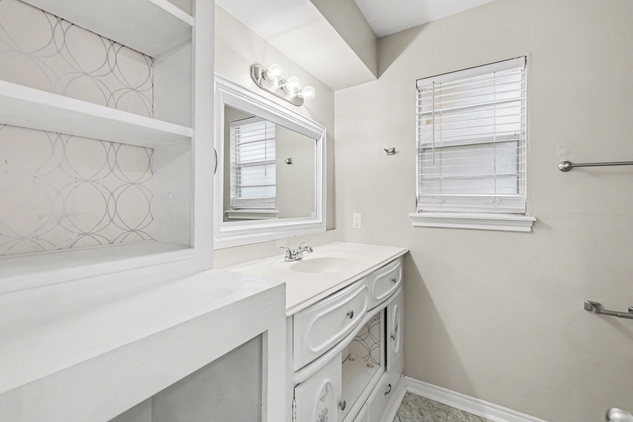 107 Carriage Lane Conroe, TX 77385 - Photo 24 of 26 a bathroom with a sink and a mirror