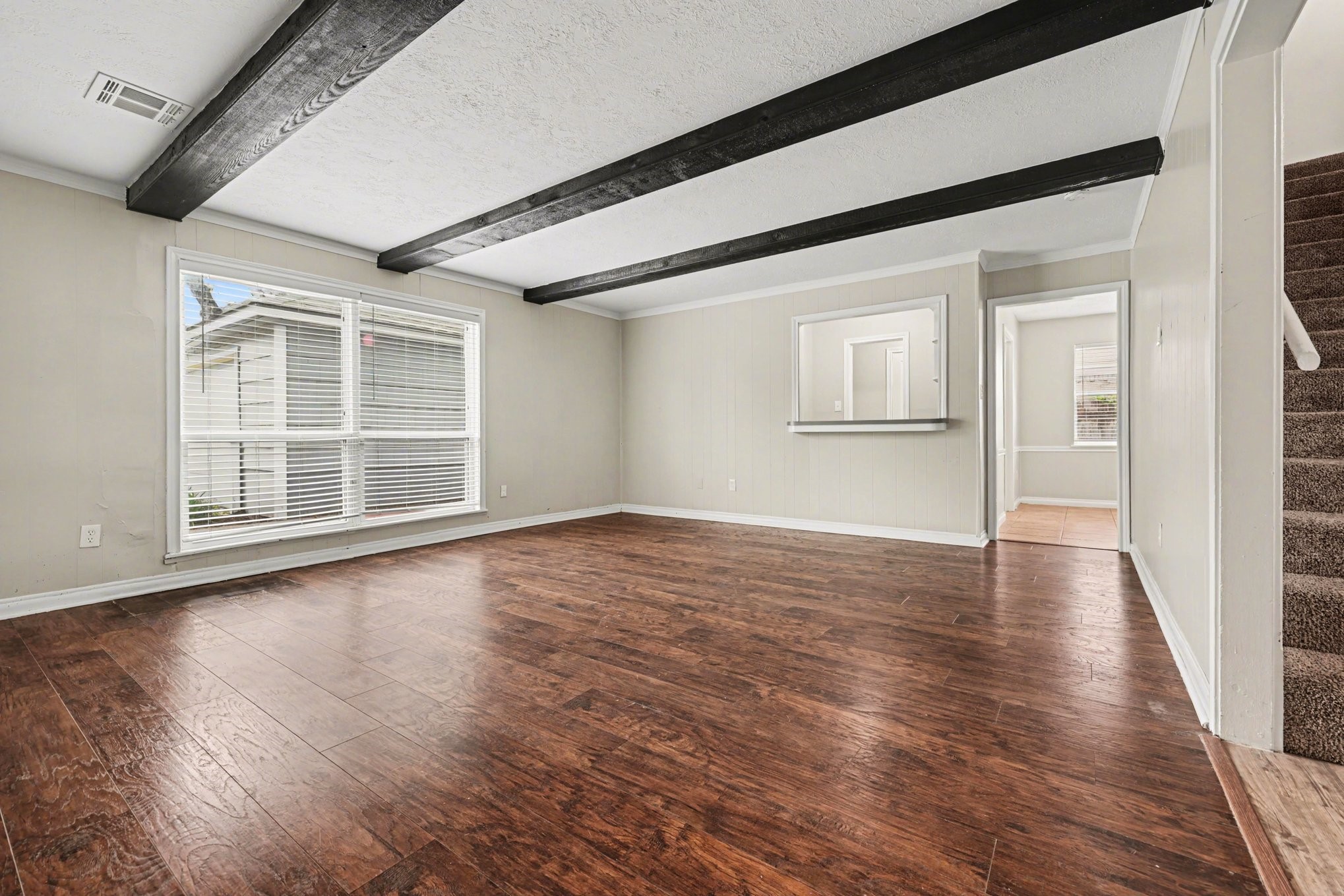 107 Carriage Lane Conroe, TX 77385 - Photo 6 of 26 a view of a livingroom with wooden floor