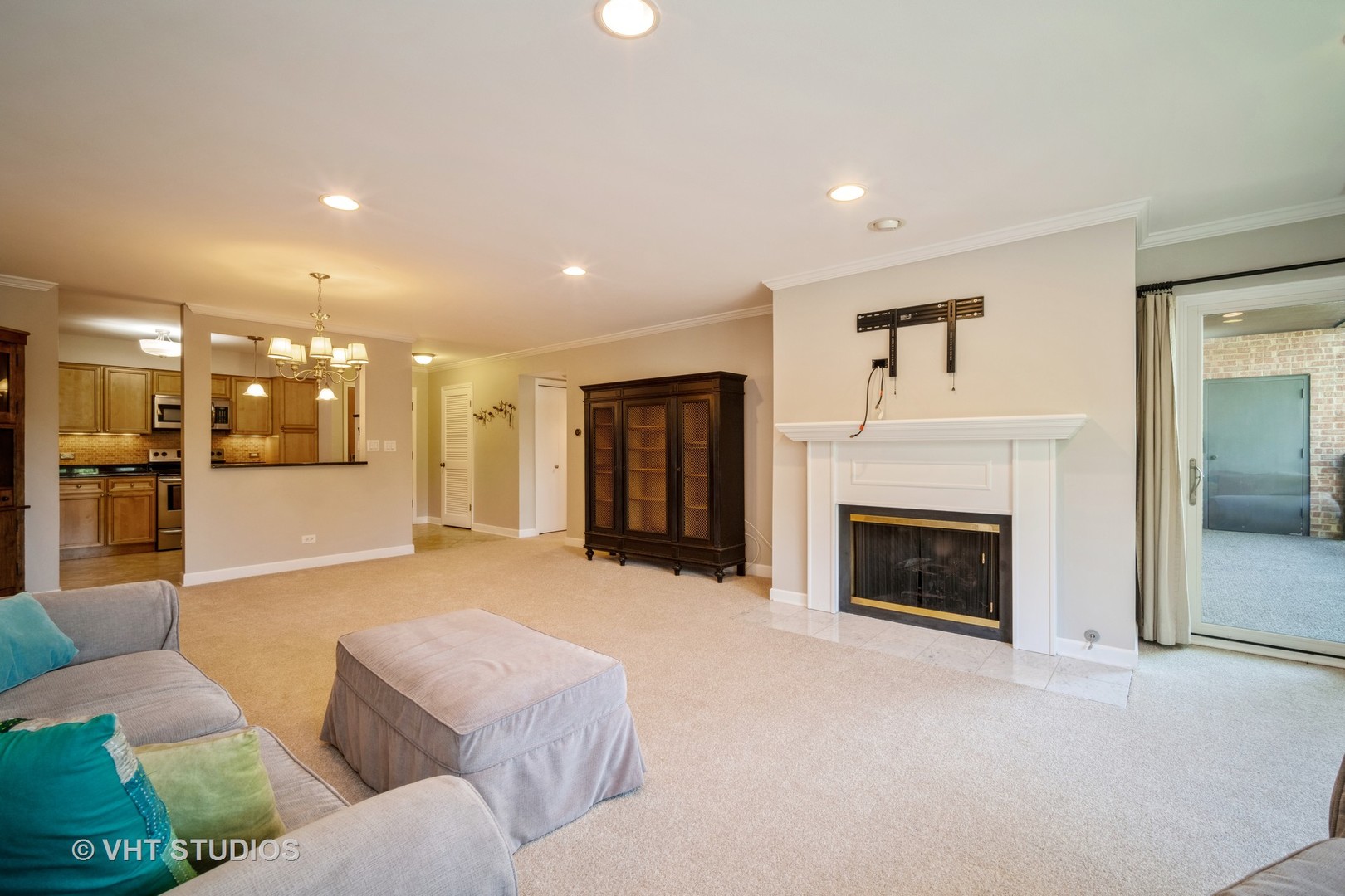 1088 Shermer Road, Unit 203 Northbrook, IL 60062 - Photo 8 of 15 a living room with furniture and a fireplace