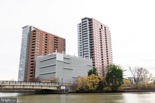 a view of a street with cars parked