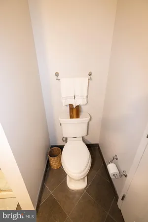 a living room with furniture a flat screen tv and a large window