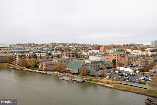 a bed room with a bed and a chair