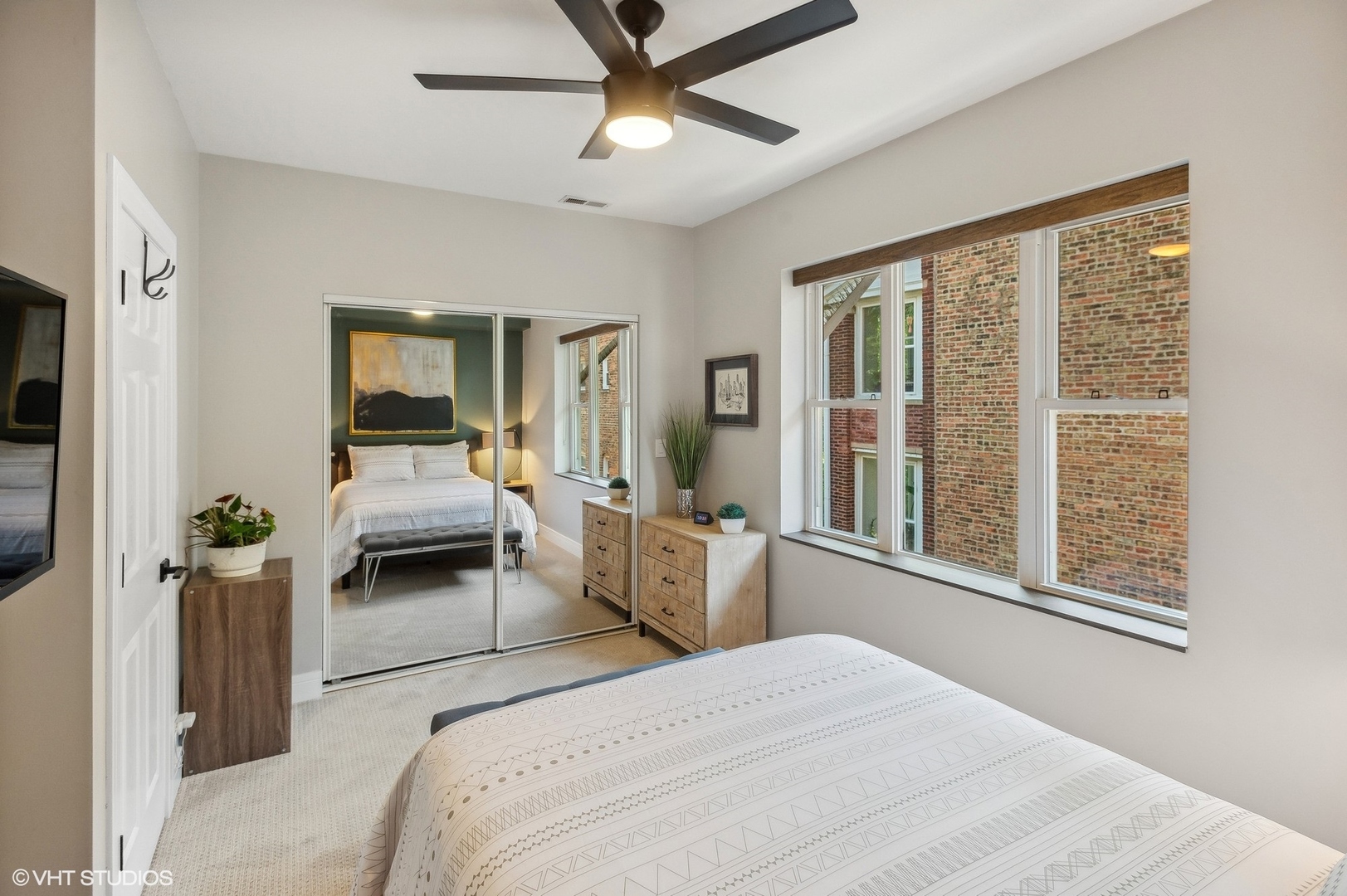 4438 North Racine Avenue, Unit B Chicago, IL 60640 - Photo 12 of 26 a bedroom with a bed and large window