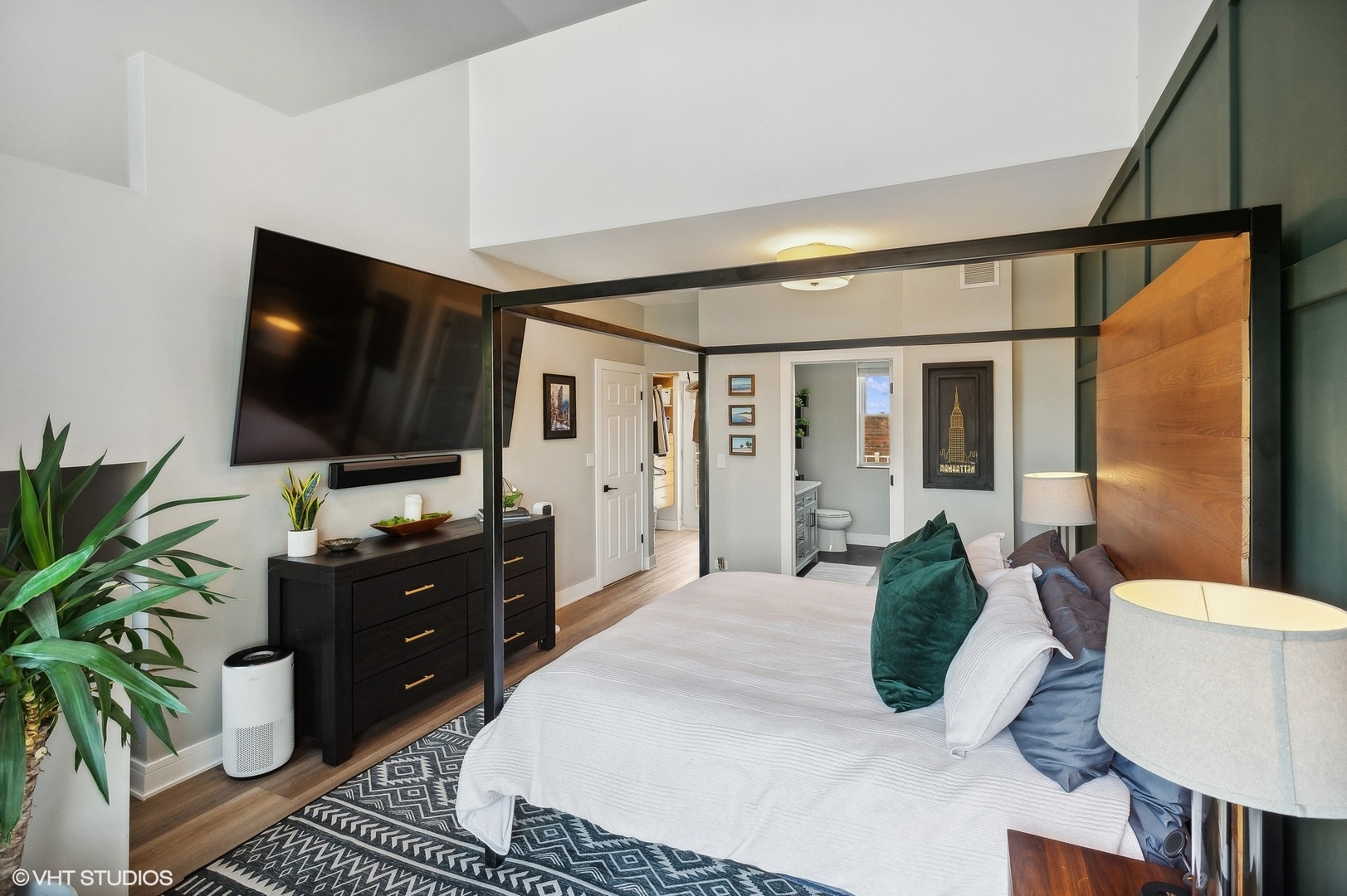 4438 North Racine Avenue, Unit B Chicago, IL 60640 - Photo 19 of 26 a bedroom with a bed and a flat screen tv