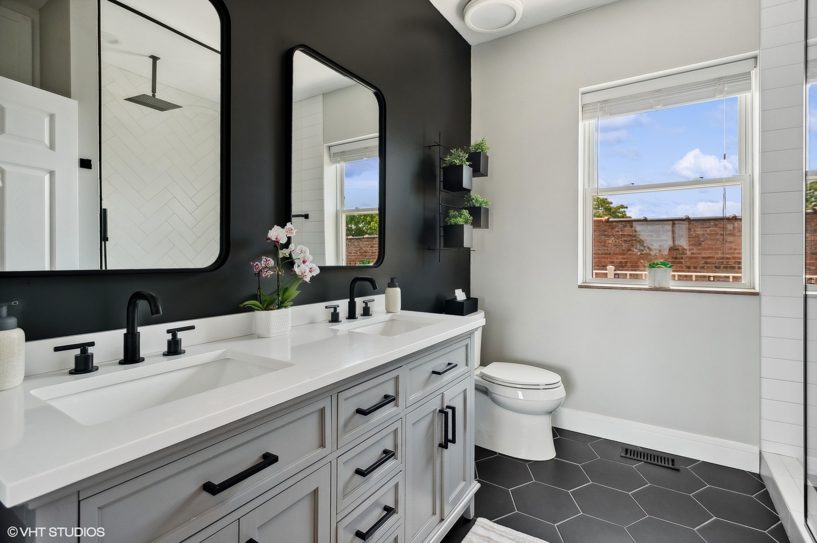 4438 North Racine Avenue, Unit B Chicago, IL 60640 - Photo 20 of 26 a bathroom with a toilet sink and mirror