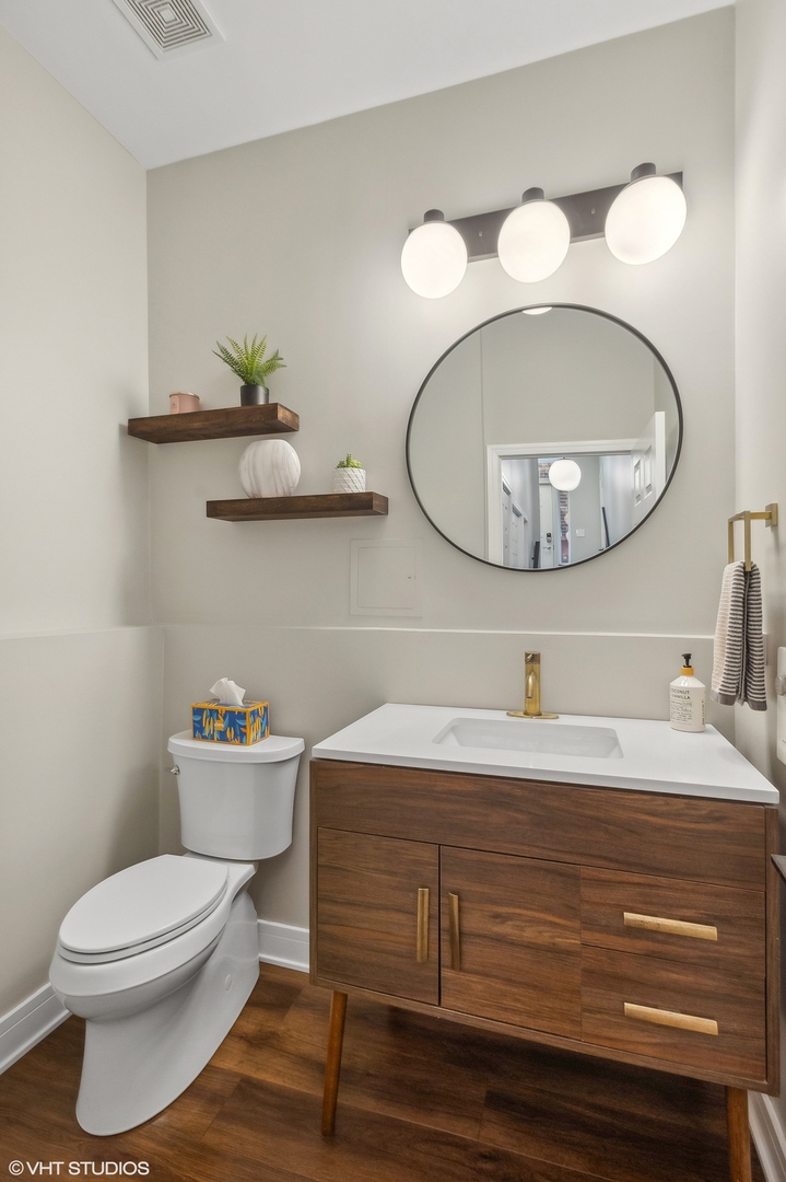 4438 North Racine Avenue, Unit B Chicago, IL 60640 - Photo 26 of 26 a bathroom with a sink and a mirror