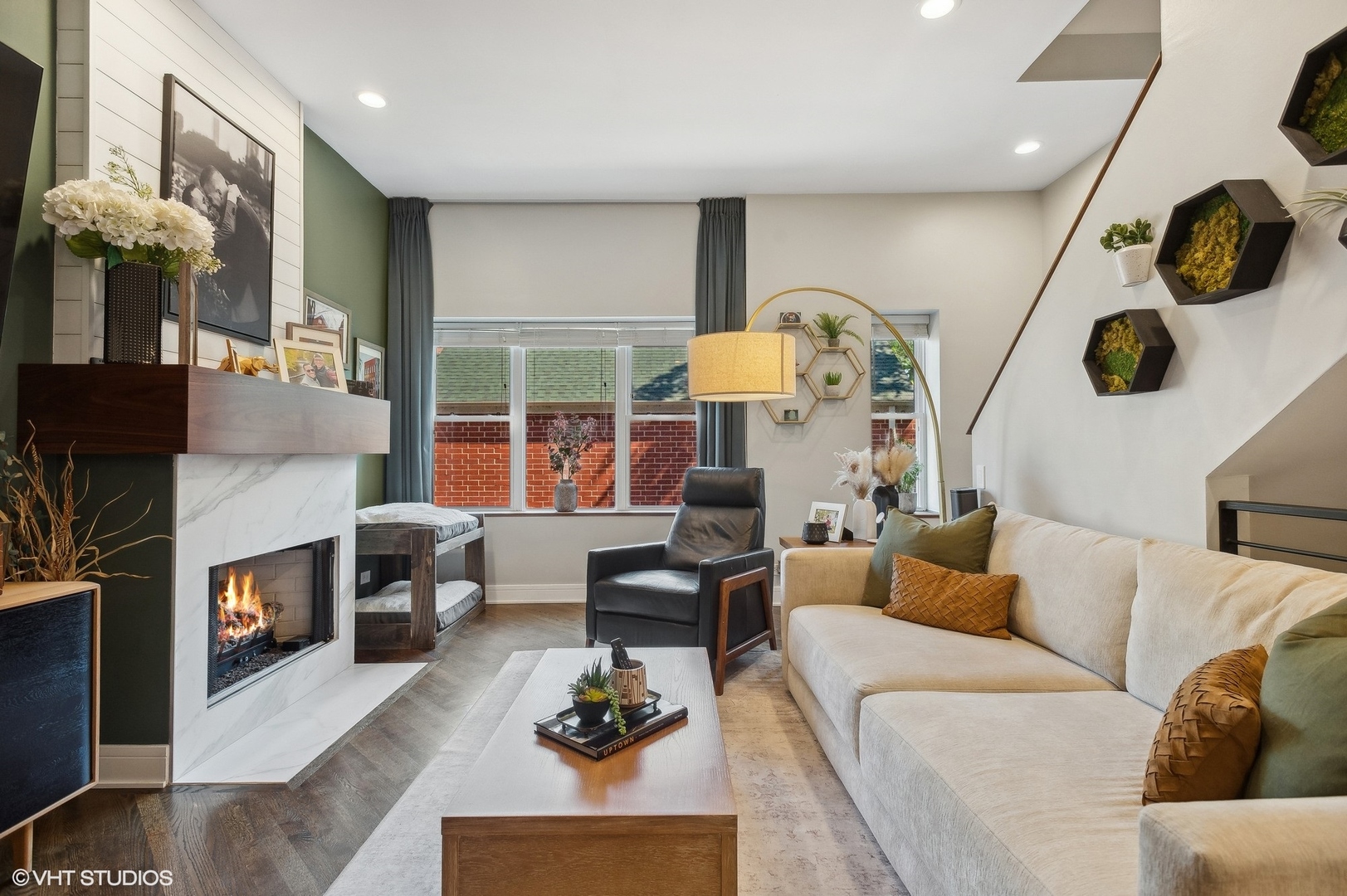 4438 North Racine Avenue, Unit B Chicago, IL 60640 - Photo 5 of 26 a living room with furniture and a fireplace