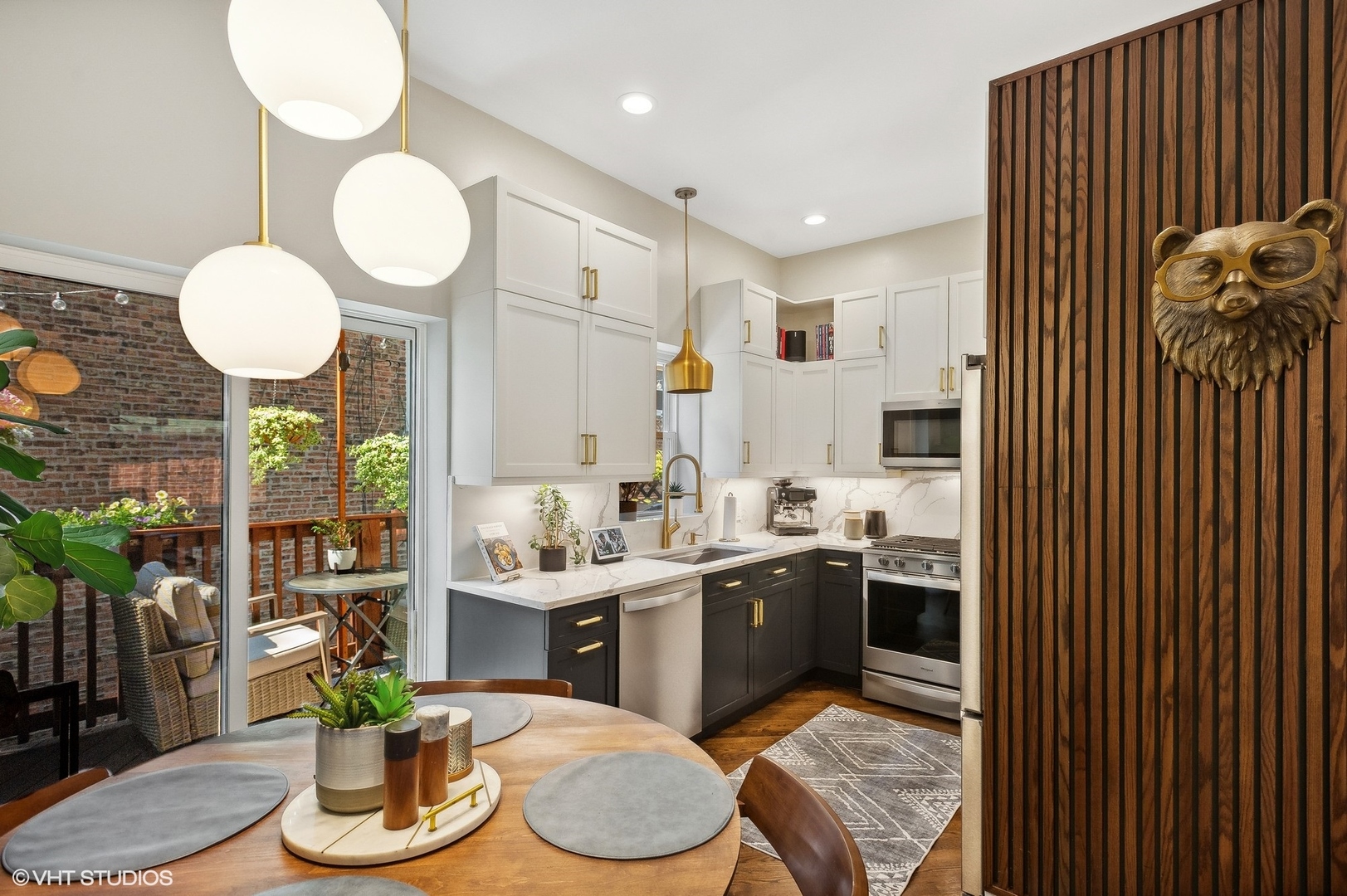 4438 North Racine Avenue, Unit B Chicago, IL 60640 - Photo 6 of 26 a kitchen with sink cabinets and outdoor space