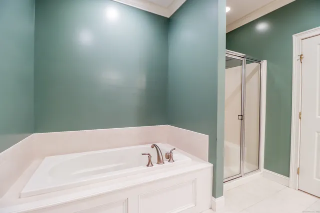 a bathroom with a bathtub and a sink