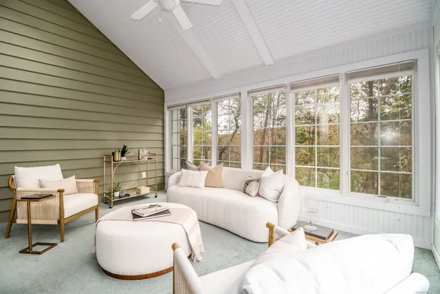 a living room with furniture and a window