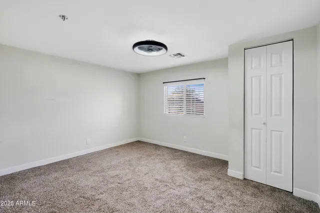 a view of a room with wooden floor sink and bathroom
