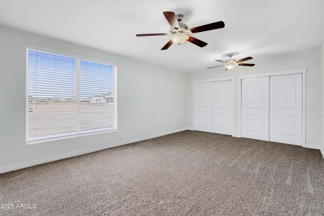 a bathroom with a granite countertop sink mirror vanity and a bathtub