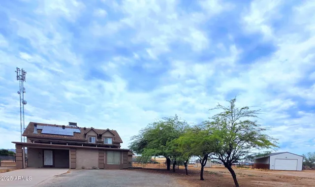 a view of a garden with sitting area