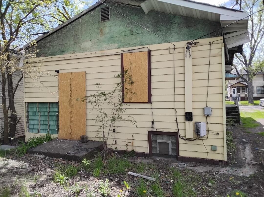 823 Pierce Street Gary, IN 46402 - Photo 3 of 6 a front view of a house with a yard