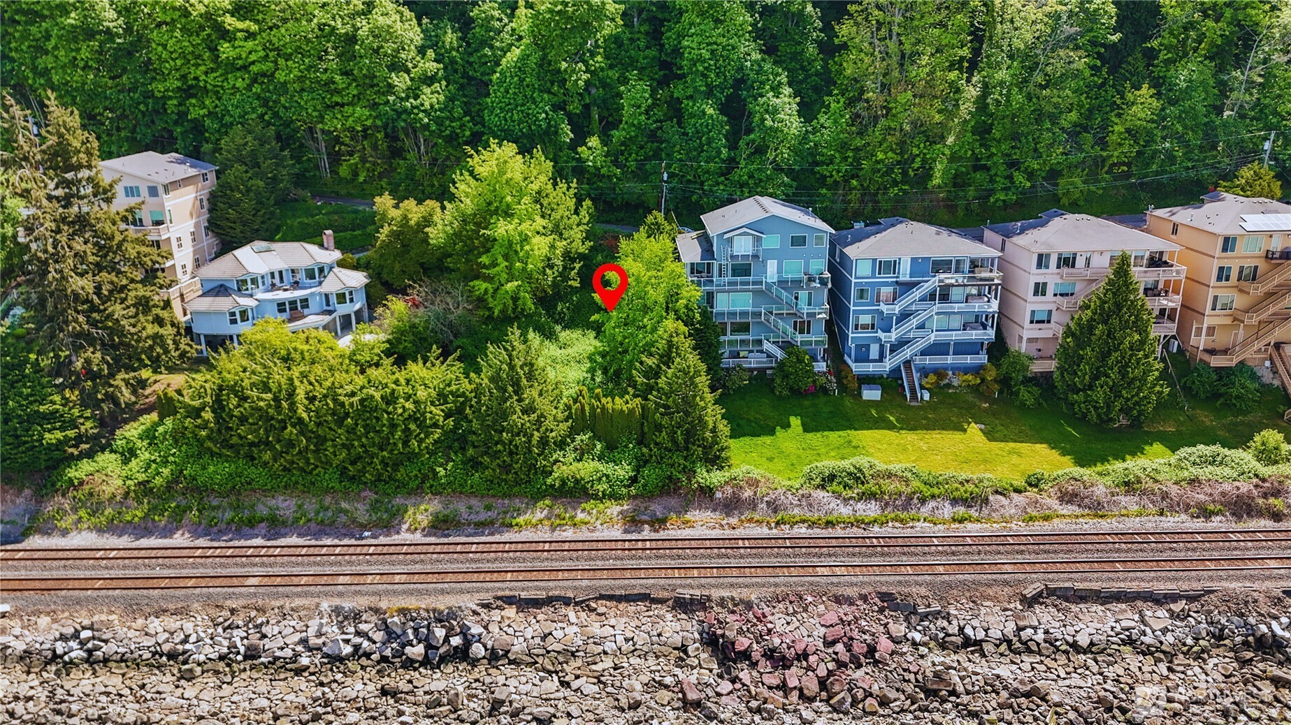 12104 Possession Lane Edmonds, WA 98026 - Photo 6 of 10 a front view of a house with a yard and large tree