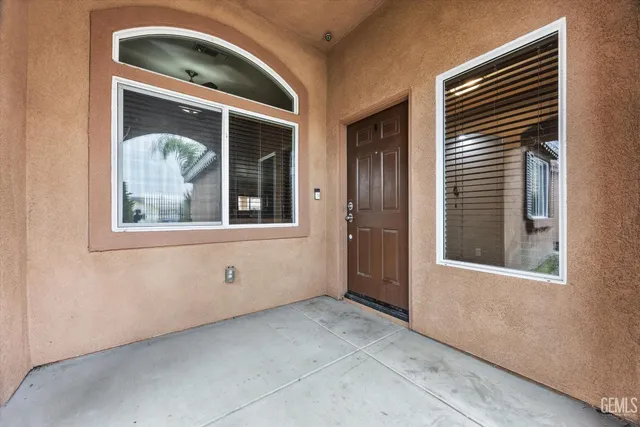 a view of a big room with closet and wooden shelves