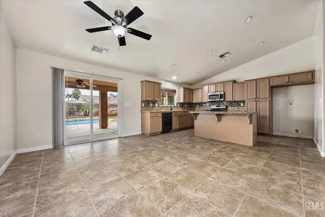 a kitchen with a sink a counter top space and appliances