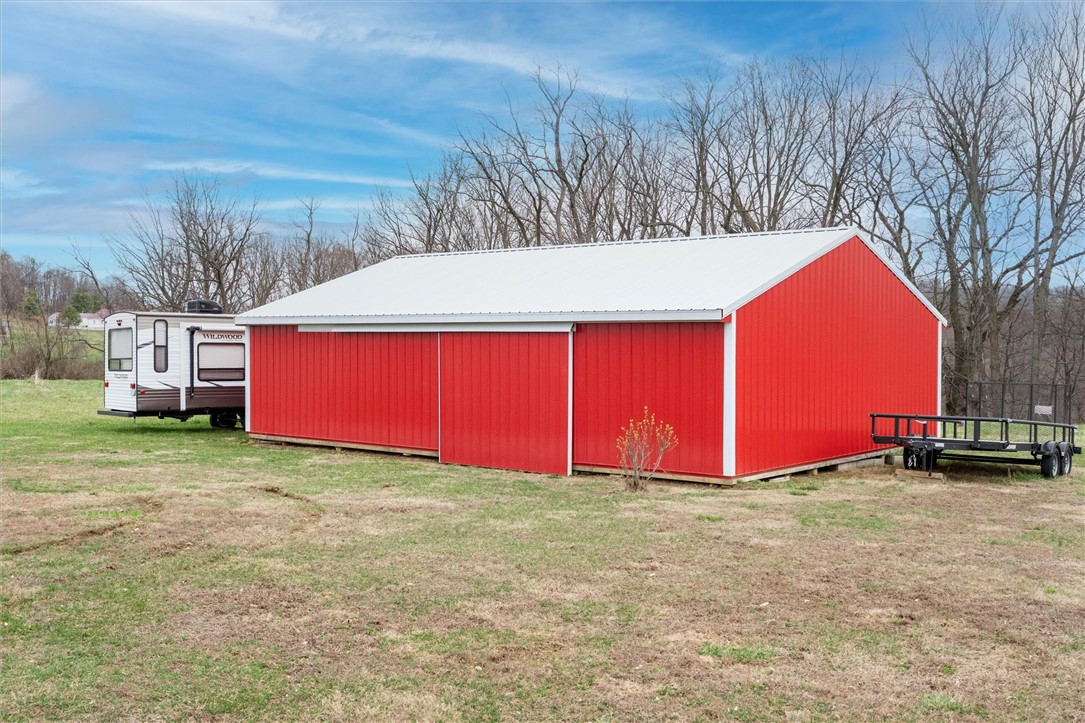 1926 Fairview Road Peebles, OH 45660 - Photo 18 of 44 This vibrant red barn with a crisp white roof offers expansive storage for your property needs.