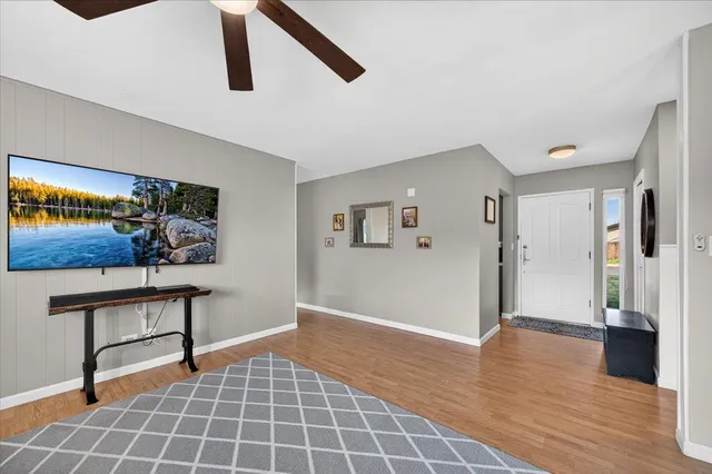 a view of an entryway with wooden floor