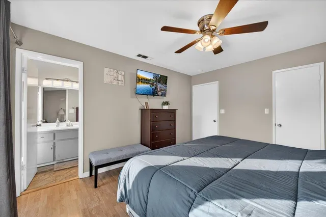 a bedroom with a bed and window