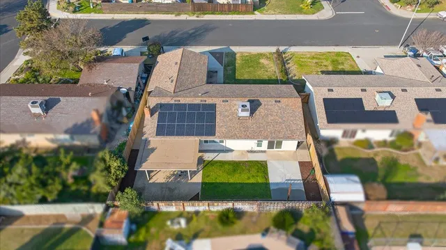 an aerial view of a house with a swimming pool