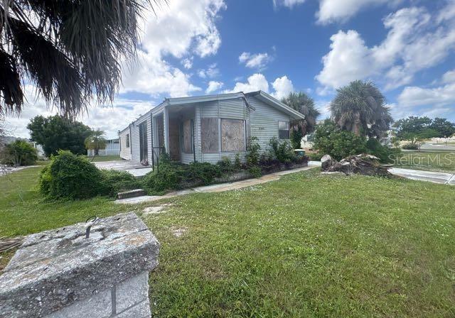 8407 Buttonquail Drive Englewood, FL 34224 - Photo 1 of 5 a front view of a house with garden