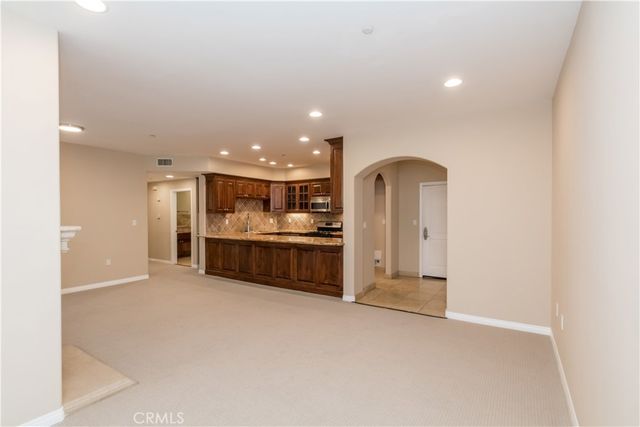 a view of a kitchen with a sink and a stove top oven