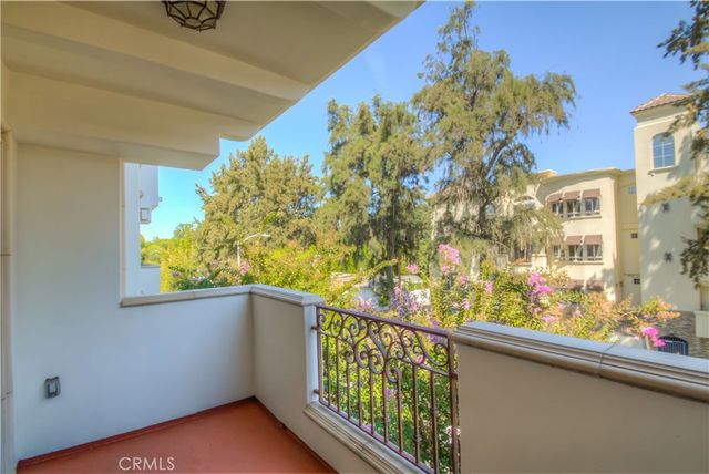 a view of balcony with wooden floor
