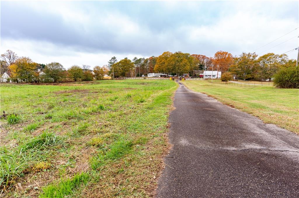 8105 Jot Em Down Road Gainesville, GA 30506 - Photo 12 of 73 a view of an outdoor space and a yard