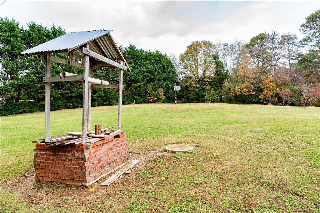8105 Jot Em Down Road Gainesville, GA 30506 - Photo 13 of 73 a view of a house with backyard and sitting area