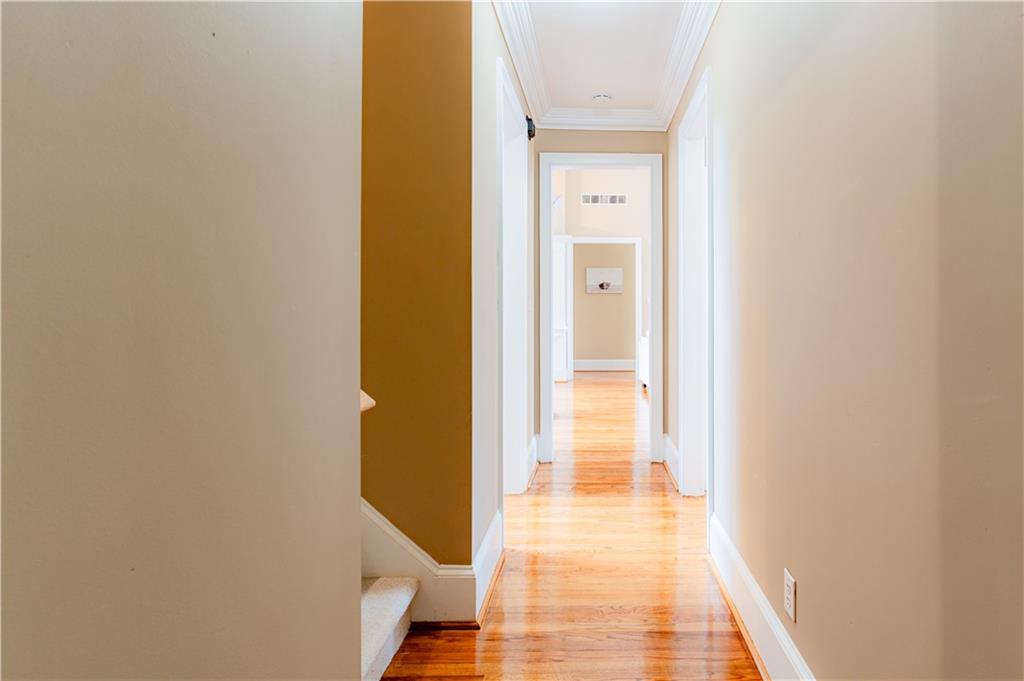 8105 Jot Em Down Road Gainesville, GA 30506 - Photo 15 of 73 a view of a hallway with a wooden floor