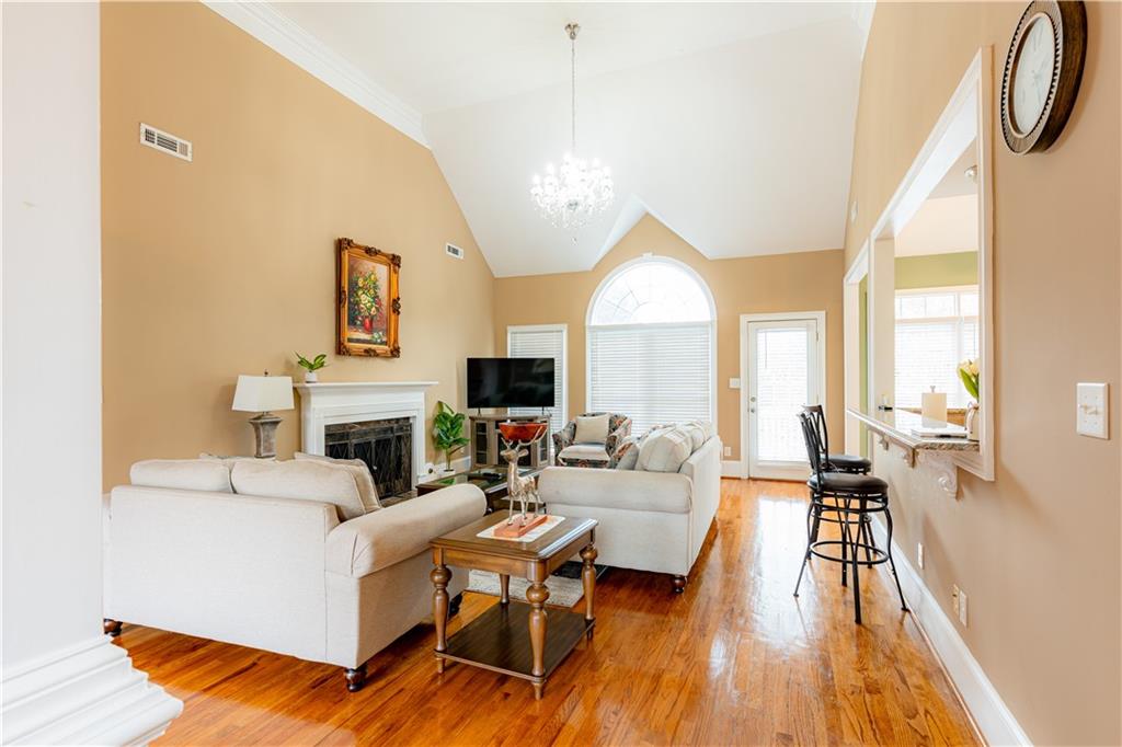 8105 Jot Em Down Road Gainesville, GA 30506 - Photo 16 of 73 a living room with furniture and a fireplace