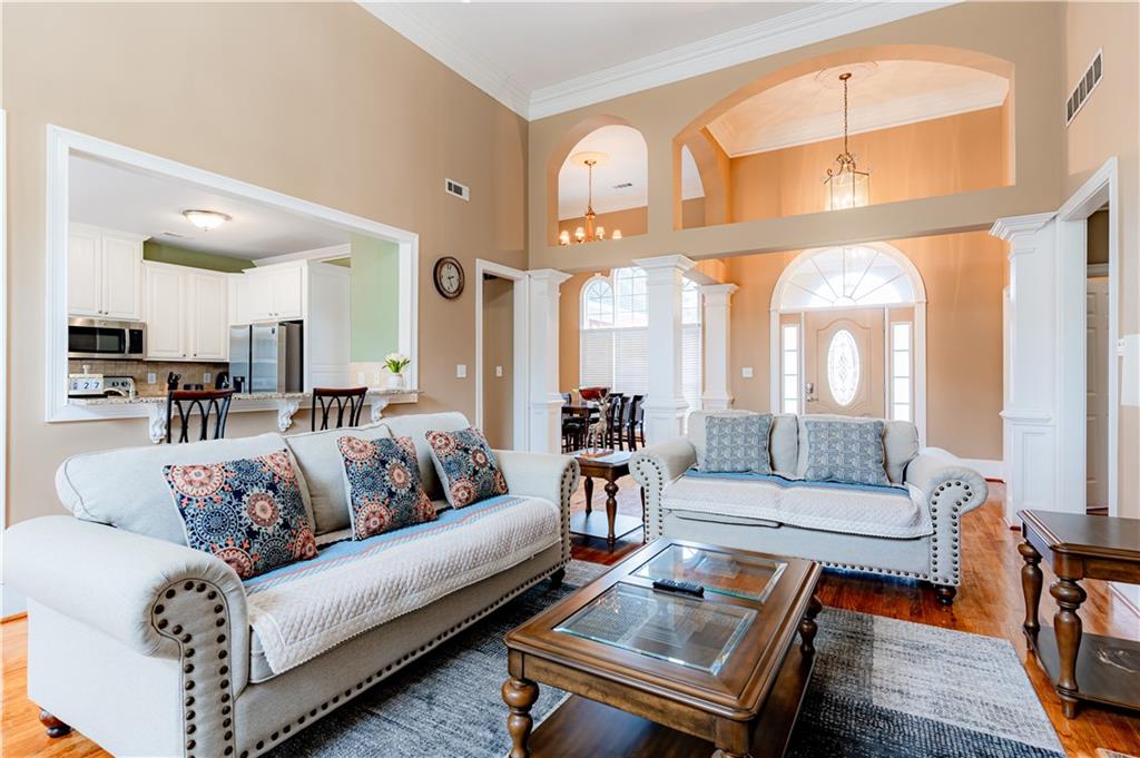 8105 Jot Em Down Road Gainesville, GA 30506 - Photo 19 of 73 a living room with furniture and a large window