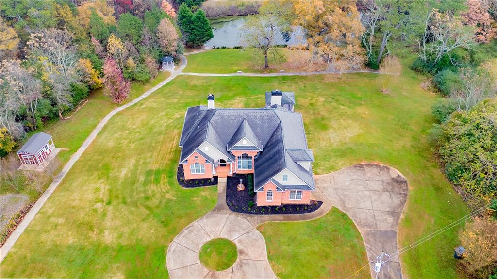 8105 Jot Em Down Road Gainesville, GA 30506 - Photo 2 of 73 an aerial view of a house with swimming pool