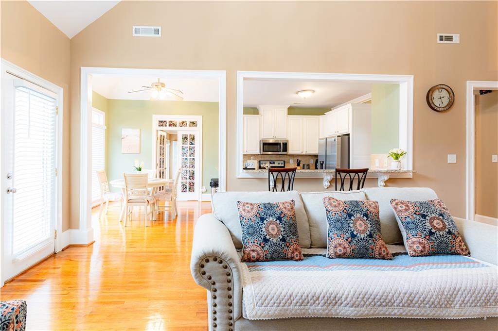 8105 Jot Em Down Road Gainesville, GA 30506 - Photo 21 of 73 a living room with furniture and wooden floor