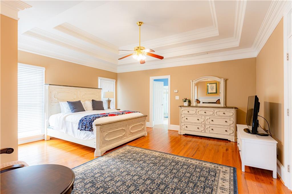 8105 Jot Em Down Road Gainesville, GA 30506 - Photo 31 of 73 a bedroom with natural light and wooden floor
