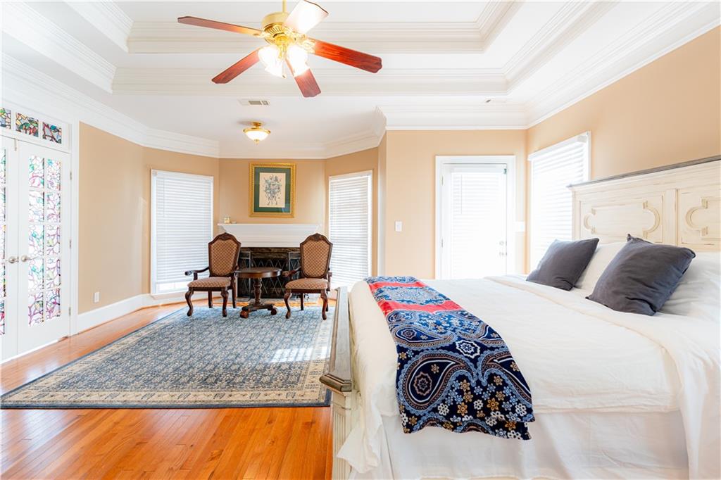 8105 Jot Em Down Road Gainesville, GA 30506 - Photo 33 of 73 a bed room with a bed and a chair