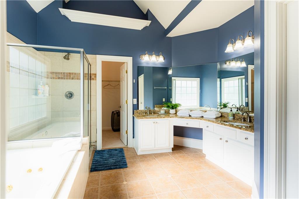8105 Jot Em Down Road Gainesville, GA 30506 - Photo 35 of 73 a large white kitchen with a large tub and sink