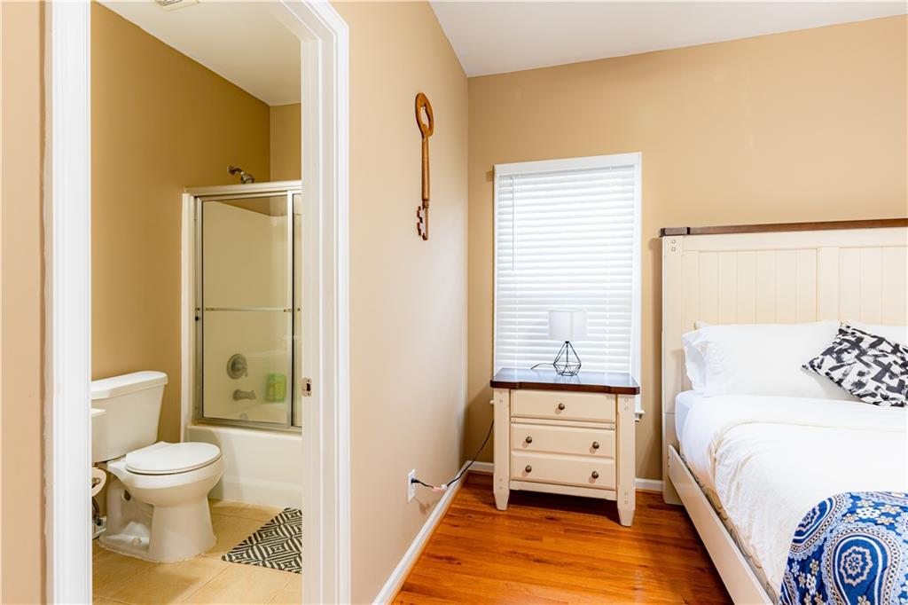 8105 Jot Em Down Road Gainesville, GA 30506 - Photo 41 of 73 a en suite bathroom with a toilet sink and a shower